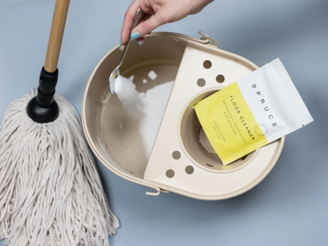 Cleaning powder being added to a mop bucket
