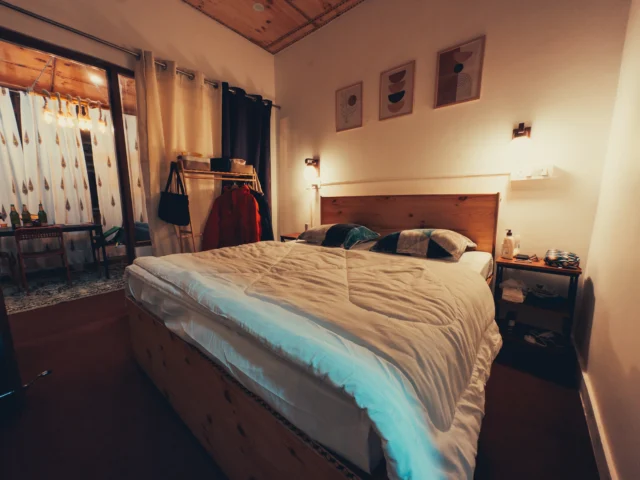 Cosy bedroom with a large bed and bedside table