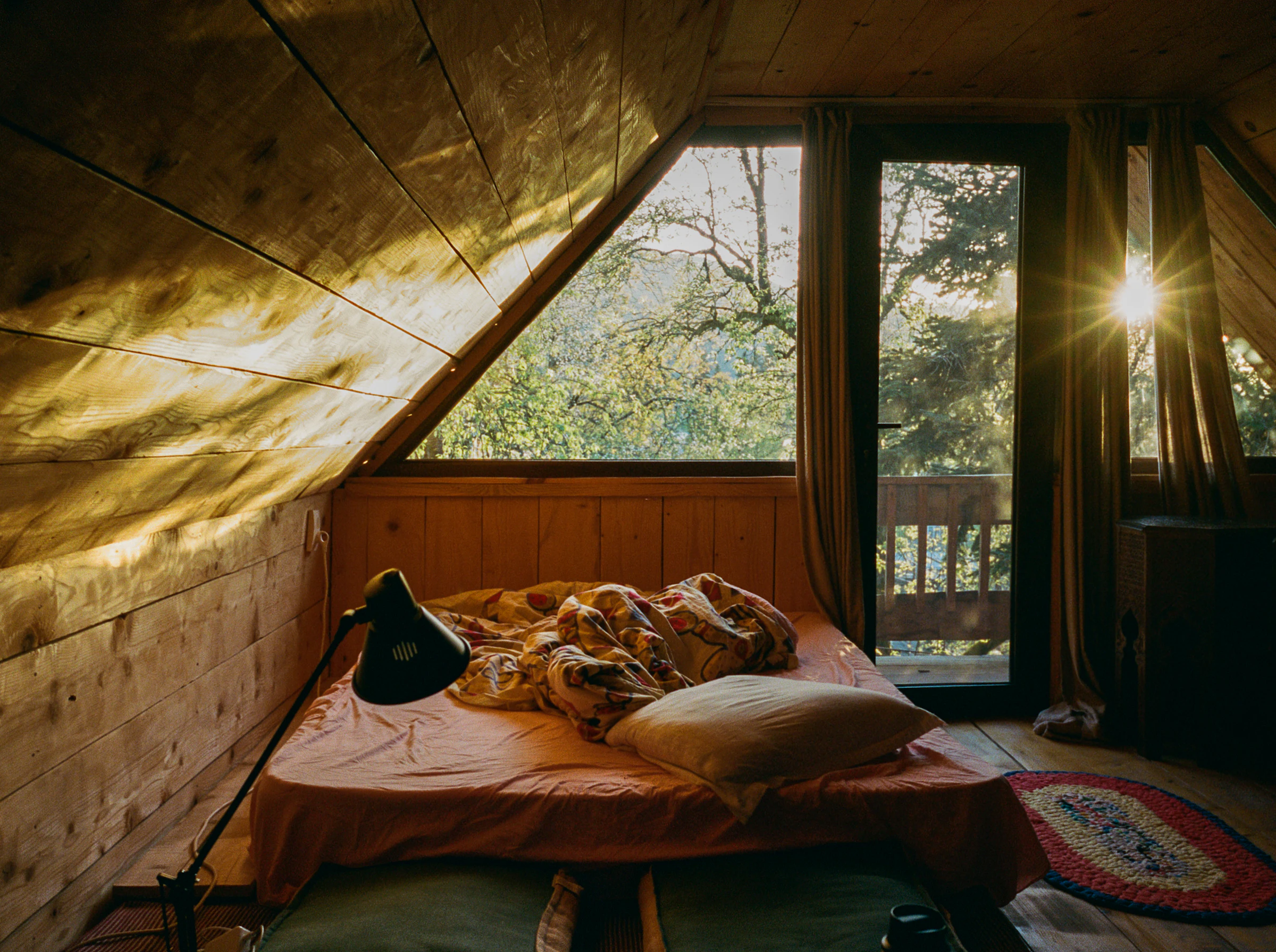 Cosy holiday cottage bedroom with fresh linen in the sunlight