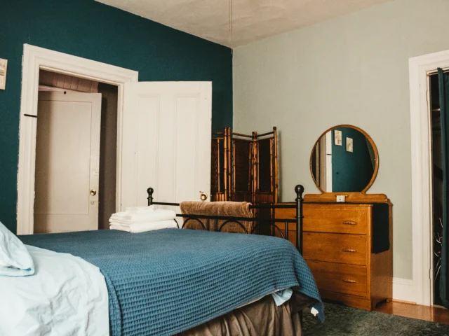 Freshly made bed with white linen