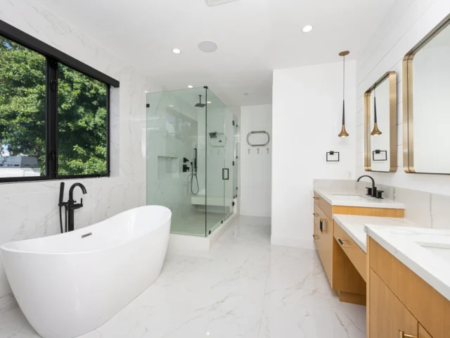 Large white bathroom with a freestanding bath