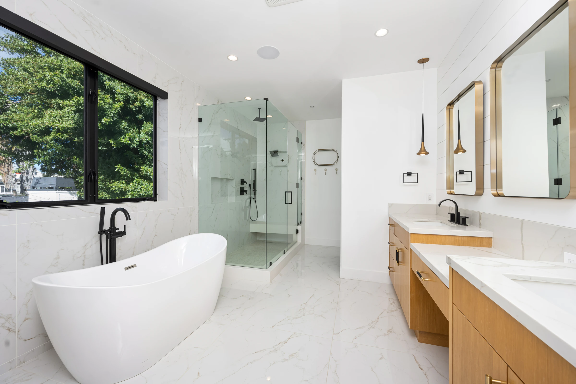 Large white bathroom with a freestanding bath