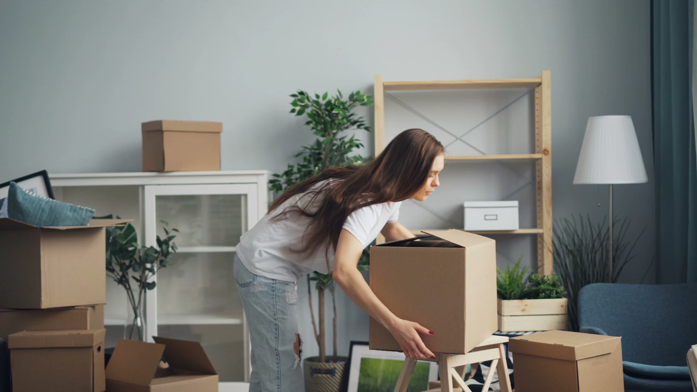 Moving boxes in a bright living room on moving day