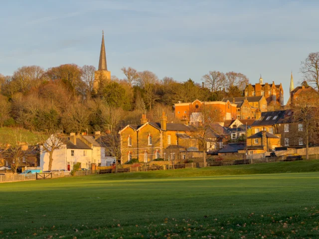 Sunny English market town on a tree-lined hillside