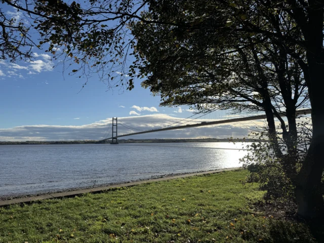 The Humber estuary and Humber Bridge under a blue sky