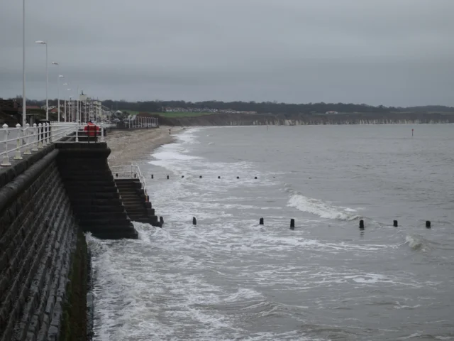 Waves breaking against a sea wall on the East Yorkshire coast