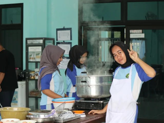 Young people cooking together in a shared kitchen