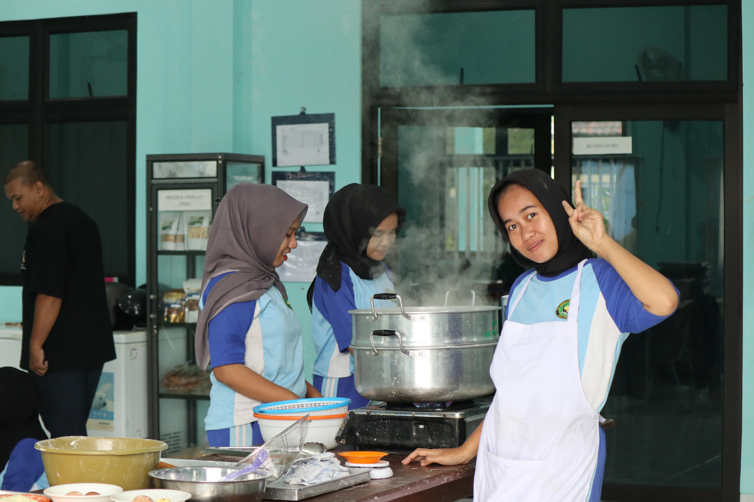 Young people cooking together in a shared kitchen